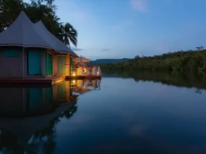 Canvas and Orchids Retreat floating tented villa evening